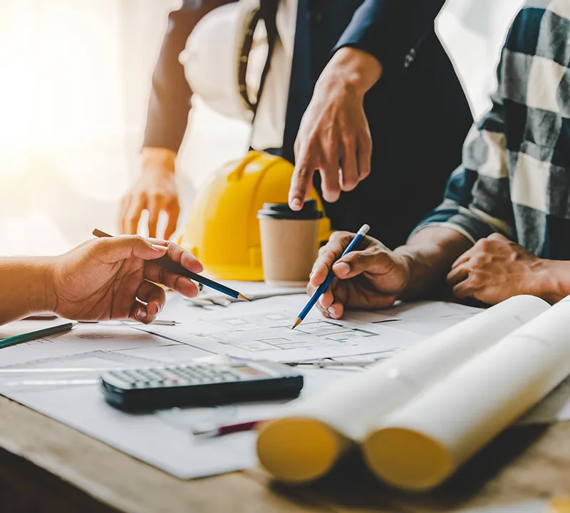 Workers looking over blueprints