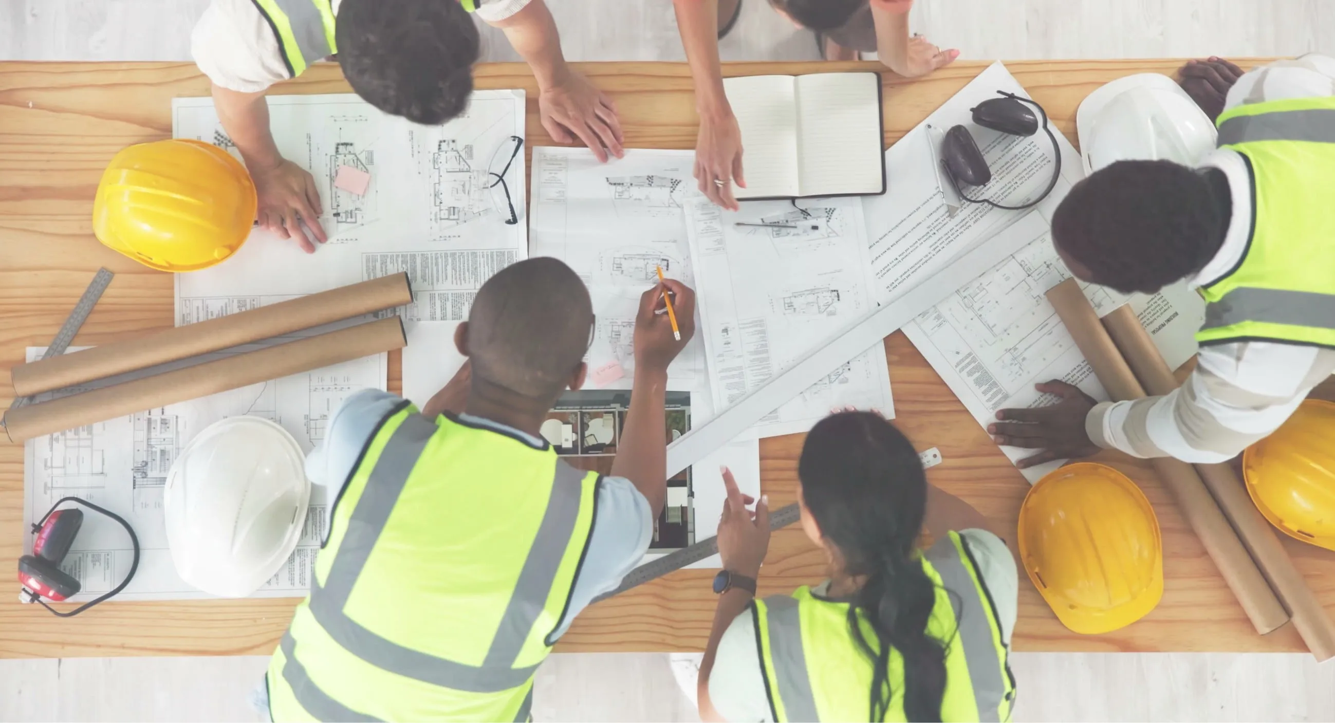 Workers looking over blueprints